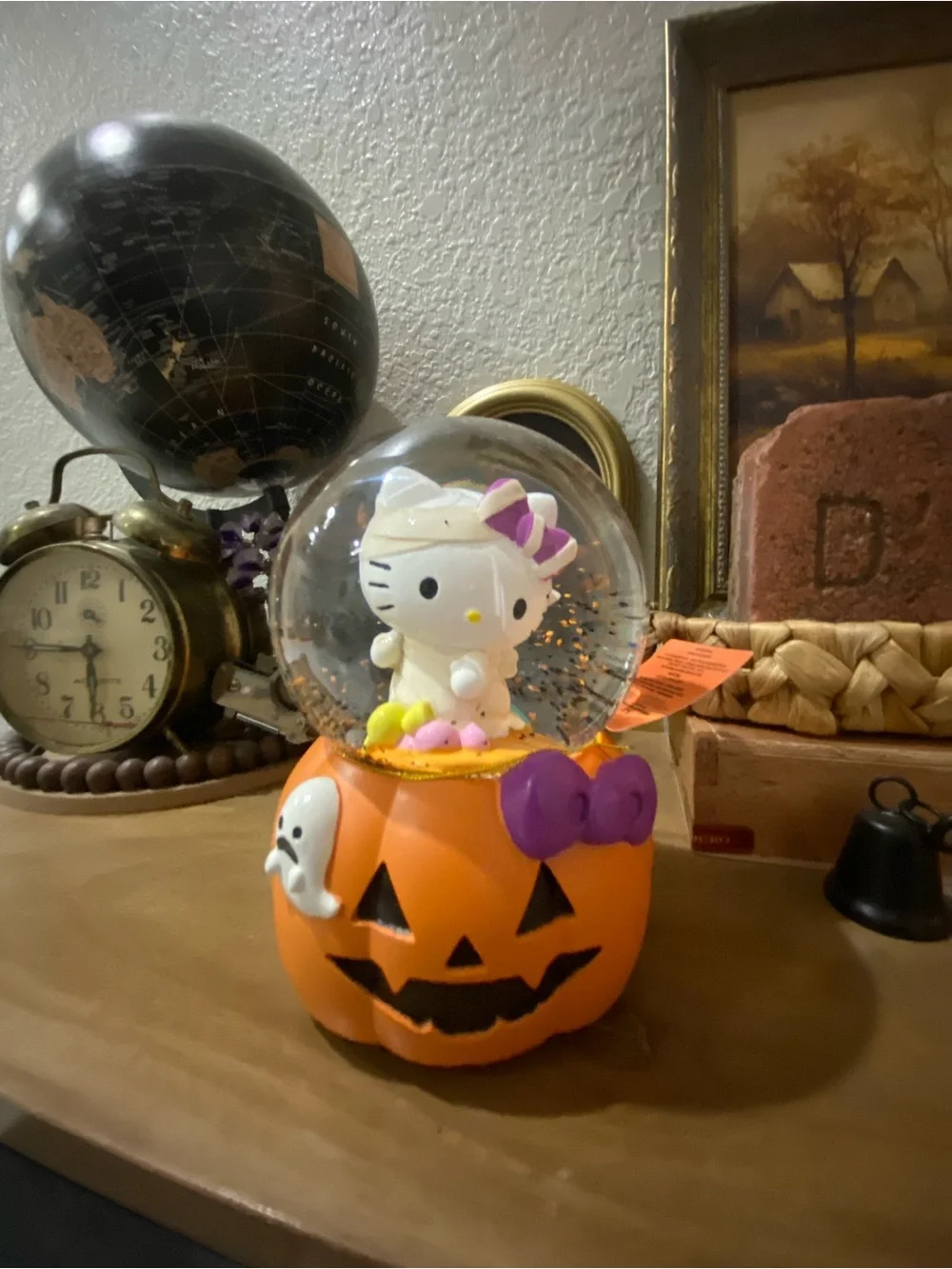 Hello Kitty Orange Pumpkin musical Snow Globe with Purple Bow Accent